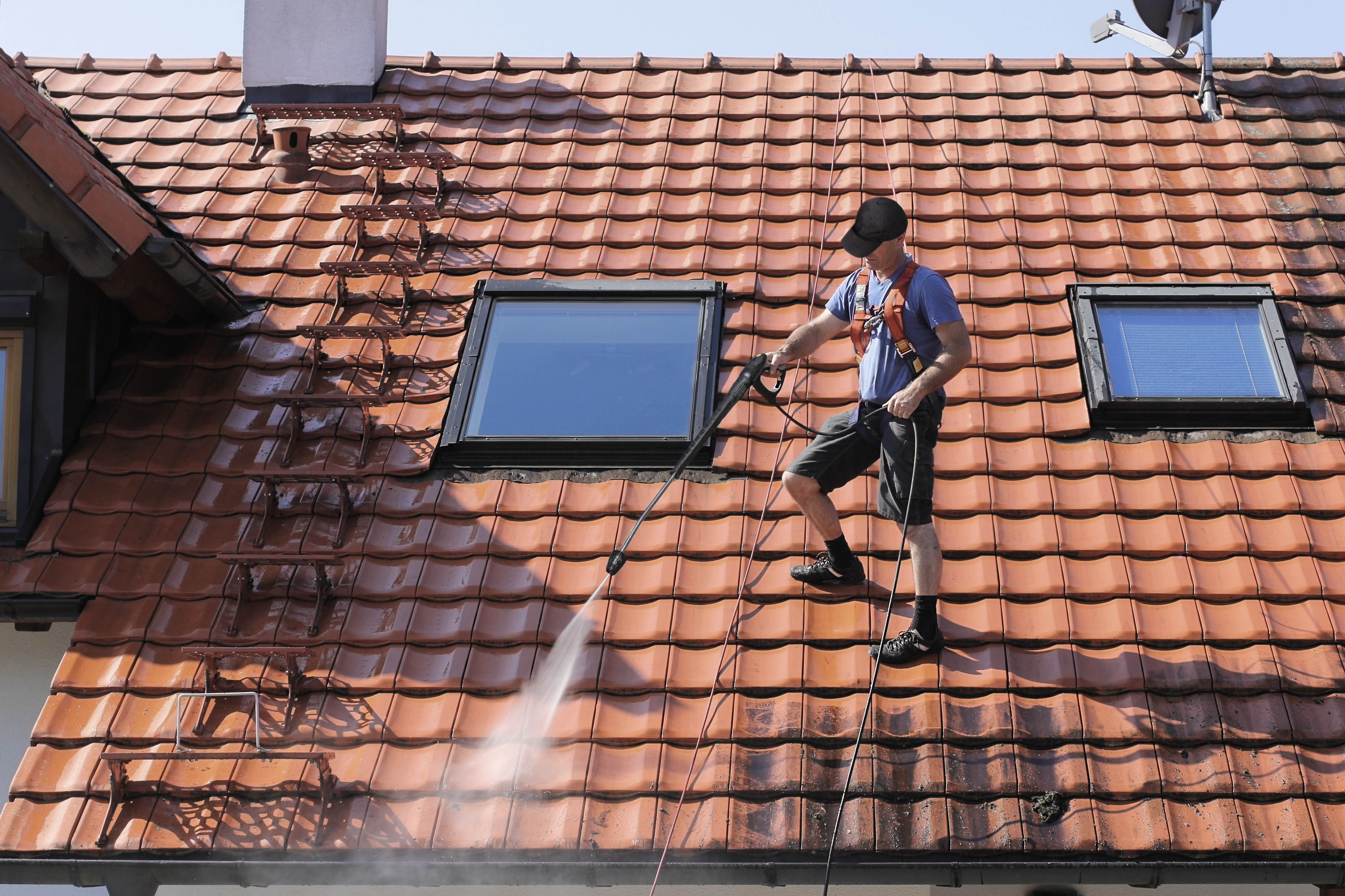 GC Roof Coatings professional tradesman on a pristine residential roof exterior